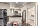 Well-lit kitchen features white cabinetry, stainless steel appliances, and open access to bathroom at 4343 N 21St St # 158, Phoenix, AZ 85016
