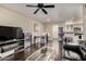 Expansive living area with wood floors leads to kitchen and dining space at 4343 N 21St St # 158, Phoenix, AZ 85016