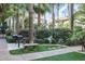 Community outdoor grilling area offers benches, manicured grass, and mature landscaping at 4343 N 21St St # 158, Phoenix, AZ 85016