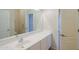 Bathroom with a large mirror over a double sink vanity and a door leading to another room at 44092 W Stonecreek Rd, Maricopa, AZ 85139