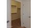 Walk-in closet with multiple shelves for optimal storage at 44092 W Stonecreek Rd, Maricopa, AZ 85139
