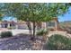 The house is surrounded by trees and desert vegetation at 44092 W Stonecreek Rd, Maricopa, AZ 85139