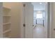Walk-in pantry with ample shelving for organized storage at 44092 W Stonecreek Rd, Maricopa, AZ 85139