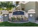 Elegant address sign with stone accents and lush landscaping adding to the property's curb appeal at 4455 E Paradise Village S Pkwy # 1057, Phoenix, AZ 85032