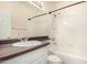 Well-lit bathroom featuring a shower-tub combo, a spacious mirror, and modern vanity at 4455 E Paradise Village S Pkwy # 1057, Phoenix, AZ 85032