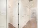 Bright hallway leading to bedrooms with a neutral color scheme and carpeted flooring throughout at 4455 E Paradise Village S Pkwy # 1057, Phoenix, AZ 85032