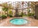 Relaxing hot tub area with overhead trellis and nearby seating for a peaceful outdoor experience at 4455 E Paradise Village S Pkwy # 1057, Phoenix, AZ 85032