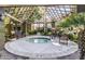 Enclosed hot tub area with pergola, offering a tranquil spot for relaxation and socializing at 4455 E Paradise Village S Pkwy # 1057, Phoenix, AZ 85032