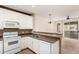 Well-equipped kitchen with white cabinets and access to the bright living area at 4455 E Paradise Village S Pkwy # 1057, Phoenix, AZ 85032