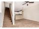 Inviting living room featuring a staircase, modern lighting, and an open-concept layout at 4455 E Paradise Village S Pkwy # 1057, Phoenix, AZ 85032