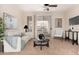 Bright living room featuring modern decor, neutral tones, and sliding glass doors to the balcony at 4455 E Paradise Village S Pkwy # 1057, Phoenix, AZ 85032