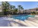 Community pool with ample deck space and palm trees, ideal for residents' enjoyment and relaxation at 4455 E Paradise Village S Pkwy # 1057, Phoenix, AZ 85032