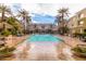 Beautiful pool area with lush landscaping, sun loungers, and palm trees for a resort-like feel at 4455 E Paradise Village S Pkwy # 1057, Phoenix, AZ 85032