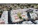 Rooftop aerial showcases dense neighborhood featuring white condos and townhomes, and sparse trees at 4733 W Eva St, Glendale, AZ 85302