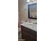 Charming bathroom with colorful accents, pink toilet and vanity sink combo at 4733 W Eva St, Glendale, AZ 85302