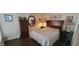 Inviting bedroom with hardwood floors, dresser, and comfortable decor at 4733 W Eva St, Glendale, AZ 85302