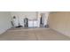 Functional garage space with washer, dryer, water heater, and storage cabinets at 4733 W Eva St, Glendale, AZ 85302