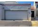 Attached one car garage with white door and stucco facade at 4733 W Eva St, Glendale, AZ 85302