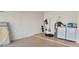 Spacious garage with washer, dryer, water heater, and storage; ideal for projects and organization at 4733 W Eva St, Glendale, AZ 85302