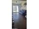 Bright living room with hardwood floors and comfortable leather furniture at 4733 W Eva St, Glendale, AZ 85302
