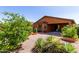 This backyard is landscaped with gravel and plants at 47719 N Camino Del Sol --, Gold Canyon, AZ 85118