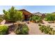 This backyard is landscaped with gravel and potted plants at 47719 N Camino Del Sol --, Gold Canyon, AZ 85118
