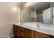 Bathroom with double sinks, a large mirror, and a shower with glass door at 47719 N Camino Del Sol --, Gold Canyon, AZ 85118