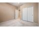 This is a bedroom with neutral carpet and a closet with sliding doors at 47719 N Camino Del Sol --, Gold Canyon, AZ 85118