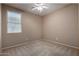Bedroom with carpet, ceiling fan, and a large window for natural light at 47719 N Camino Del Sol --, Gold Canyon, AZ 85118