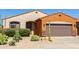 Attractive single-story home with stone accents, desert landscaping, and a two-car garage at 47719 N Camino Del Sol --, Gold Canyon, AZ 85118