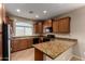 Well-equipped kitchen with granite countertops, stainless steel appliances, and ample cabinet space at 47719 N Camino Del Sol --, Gold Canyon, AZ 85118