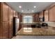 Well-equipped kitchen with granite countertops, stainless steel appliances, and ample cabinet space at 47719 N Camino Del Sol --, Gold Canyon, AZ 85118