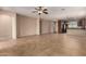 Open-concept living room with tile floors, neutral colors, and seamless flow to the kitchen at 47719 N Camino Del Sol --, Gold Canyon, AZ 85118