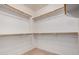 Bright walk-in closet featuring multiple levels of hanging rods for ample storage at 47719 N Camino Del Sol --, Gold Canyon, AZ 85118