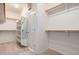 Walk-in closet with shelves, clothing rods, and a mirror at 47719 N Camino Del Sol --, Gold Canyon, AZ 85118