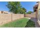A private backyard provides a relaxing outdoor space with a grassy lawn and a brick pathway at 5505 E Mclellan Rd # 111, Mesa, AZ 85205