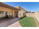 The backyard offers a cozy area with green grass, and a brick patio at 5505 E Mclellan Rd # 111, Mesa, AZ 85205