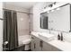 Charming bathroom featuring a tub with shower, a modern vanity with a vessel sink, and stylish black fixtures at 5505 E Mclellan Rd # 111, Mesa, AZ 85205
