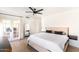 Bright primary bedroom featuring wood floors, neutral walls, french doors, and simple decor at 5505 E Mclellan Rd # 111, Mesa, AZ 85205