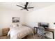 Comfortable bedroom with a ceiling fan, natural light, and a dedicated workspace for a modern living at 5505 E Mclellan Rd # 111, Mesa, AZ 85205
