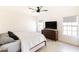 Bright primary bedroom featuring wood floors, neutral walls, and a ceiling fan at 5505 E Mclellan Rd # 111, Mesa, AZ 85205