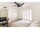 Bright bedroom boasts ample natural light, a ceiling fan, and closet space for storage and relaxation at 5505 E Mclellan Rd # 111, Mesa, AZ 85205