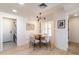 Bright dining area with a wood table and seating for four adjacent to the laundry room at 5505 E Mclellan Rd # 111, Mesa, AZ 85205