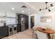 Charming kitchen featuring stainless steel appliances, floating shelves and an adjacent dining area at 5505 E Mclellan Rd # 111, Mesa, AZ 85205