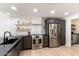 Bright kitchen featuring stainless steel appliances, modern cabinetry and marble backsplash at 5505 E Mclellan Rd # 111, Mesa, AZ 85205