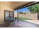 Covered patio area with brick pavers and outdoor seating, perfect for relaxing or entertaining guests at 5505 E Mclellan Rd # 111, Mesa, AZ 85205