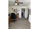 Spacious office featuring a ceiling fan, neutral carpeting, and wood furnishings perfect for a productive work environment at 5808 E Lockwood St, Mesa, AZ 85215