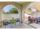 Backyard with patio, seating, fire pit, and a view of artificial turf with brick planter boxes at 6641 N Desert Shadow Ln, Phoenix, AZ 85014
