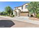 Attractive two-story home with stucco facade, brown trim, tile roof, and well-maintained landscaping at 6641 N Desert Shadow Ln, Phoenix, AZ 85014