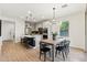 Open-concept kitchen featuring a large island, modern appliances and a view to the dining area at 6641 N Desert Shadow Ln, Phoenix, AZ 85014